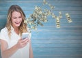 texting money. happy woman with phone, money coming up from phone. Royalty Free Stock Photo