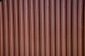 Textural background of brown corrugated metal sheet or profile panel. Royalty Free Stock Photo