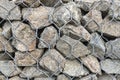 Textural background - granite stone behind a mesh netting, wall