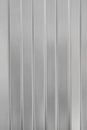 Textural background of gray corrugated metal sheet or profiled panel. Royalty Free Stock Photo