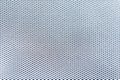 The textural background of a white grid with a shallow dark cell.