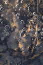 Texture abstract closeup background ice with grooves, furrows, and bubbles of air cought by frost in the mass of wated