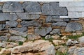 Texture of the ancient stone wall at Karthaia archeological site on Kea island, Greece Royalty Free Stock Photo