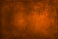 Texture for artwork and photography. Abstract burnt orange stained paper texture background or backdrop