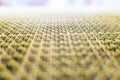 Close-up of beige fabric plastic lattice, grid texture pattern