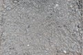 Texture of asphalt surface and crushed stone. Background asphalt road with large crushed stone Royalty Free Stock Photo