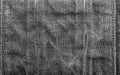 Texture backdrop photo of grey colored worn denim cloth