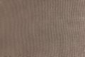 Texture background of brown velours fabric, cloth surface, weaving of jacquard material