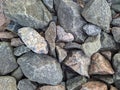 texture and background of colored stones on the river bank in the daytime Royalty Free Stock Photo