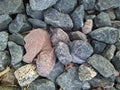 texture and background of colored stones on the river bank in the daytime Royalty Free Stock Photo