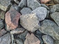 texture and background of colored stones on the river bank in the daytime Royalty Free Stock Photo