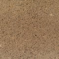 Texture background of composite stones similar to brown granite