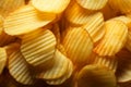 Texture background of delicious crispy potato chips in closeup view