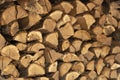 Texture of the background image of chopped oak firewood stacked in a woodpile. Copy space. Selective focus Royalty Free Stock Photo