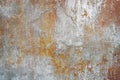 Texture background with the image of orange old plaster with cracks, abrasions and stains over the old cement coating Royalty Free Stock Photo
