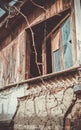 Texture, background. An old rotten window in a barn and an old abandoned house, vintage, broken glass and peeling plaster. Royalty Free Stock Photo