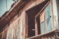 Texture, background. An old rotten window in a barn and an old abandoned house, vintage, broken glass and peeling plaster. Royalty Free Stock Photo