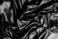 Texture, background, pattern. Black silk fabric. Fabric silk elastane satin black flowing stretch noble Royalty Free Stock Photo