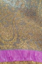 Texture, background, pattern. Combined silk white fabric and gold and silver damask fabric, pink ribbons Royalty Free Stock Photo