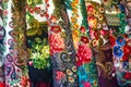 Texture background, pattern. Different fabrics stacked on a table in a pile