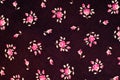 Texture, background, pattern. Fabric dark cherry color With small flowers roses, Antique Rose - Half Yard - Tan with Small Scale Royalty Free Stock Photo