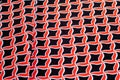 Texture, background, pattern. Fabric drawing of a diamond diamond red on a black background Royalty Free Stock Photo