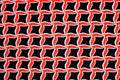 Texture, background, pattern. Fabric drawing of a diamond diamond red on a black background Royalty Free Stock Photo