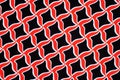 Texture, background, pattern. Fabric drawing of a diamond diamond red on a black background