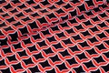 Texture, background, pattern. Fabric drawing of a diamond diamond red on a black background Royalty Free Stock Photo