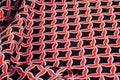 Texture, background, pattern. Fabric drawing of a diamond diamond red on a black background