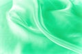 Texture, background, pattern. Green silk fabric for draping. Abs Royalty Free Stock Photo