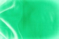 Texture, background, pattern. Green silk fabric for draping. Abs Royalty Free Stock Photo