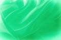 Texture, background, pattern. Green silk fabric for draping. Abs Royalty Free Stock Photo