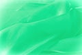 Texture, background, pattern. Green silk fabric for draping. Abs Royalty Free Stock Photo