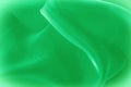 Texture, background, pattern. Green silk fabric for draping. Abs Royalty Free Stock Photo