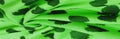 Texture, background, pattern, postcard, silk fabric, green print from the fabric of black hearts, your projects will not go Royalty Free Stock Photo