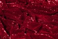 Texture, background, pattern, red fabric with paillettes. Look Royalty Free Stock Photo