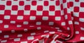 Texture background pattern. silk fabric with a pattern of red squares on a white background. This is a heavy square 100% polyester Royalty Free Stock Photo