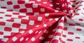 Texture background pattern. silk fabric with a pattern of red squares on a white background. This is a heavy square 100% polyester Royalty Free Stock Photo