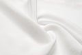 Texture background pattern. White silk fabric. Closeup of a rippled white silk fabric. Advertising space. Smooth elegant white si Royalty Free Stock Photo