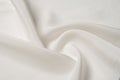 Texture background pattern. White silk fabric. Closeup of a rippled white silk fabric. Advertising space. Smooth elegant white si Royalty Free Stock Photo