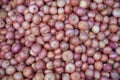 Texture or background of pile of common red onions. Royalty Free Stock Photo