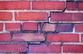 Texture background of red bricks with deep crack. Old brick wall pattern showing structural defect. Construction engineer checking Royalty Free Stock Photo