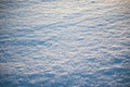 Texture and background of snow-covered surface.Sparkling snow illuminated by sunlight.