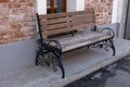 Texture background urban landscape bench with wrought iron legs. wood garden bench on city street. Close up of bench Royalty Free Stock Photo