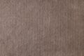 Brown velveteen upholstery fabric texture background.