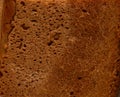 The texture of a baked rye bread crust. Background, surface. Food. Royalty Free Stock Photo