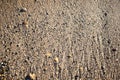 The texture of the beach with coarse sand. Background of small pebbles on the beach Royalty Free Stock Photo