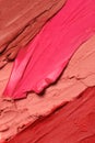 Texture of beautiful lipsticks as background, top view