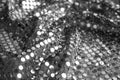 Texture of beautiful silver fabric with paillettes as background, closeup